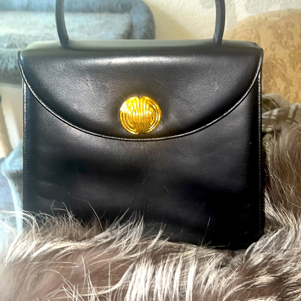 Beautiful & Unique leather Givenchy handbag with two medallion pieces to use